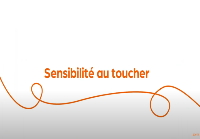 Texte « Sensibilité au toucher » avec une spirale orange sur fond blanc.