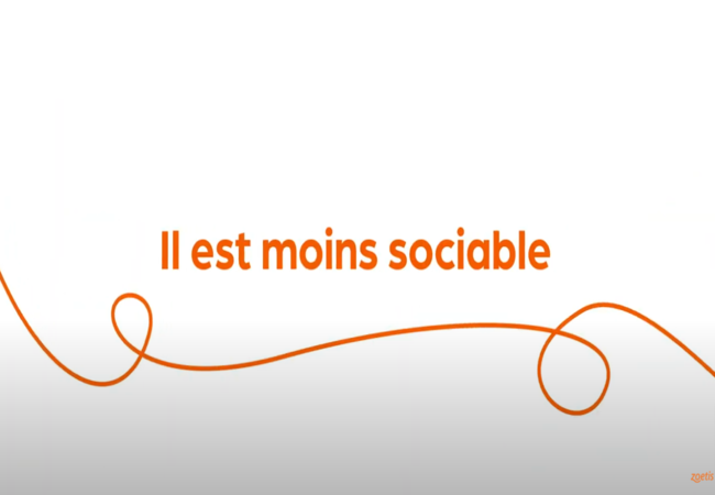 Texte « Il est moins sociable » avec une spirale orange sur fond blanc.