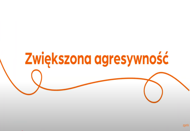 Tekst „Zwiększona agresywność” z pomarańczową spiralą na białym tle.